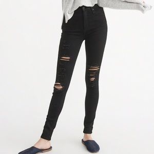 Destroyed raw hem button fly high rise jeans